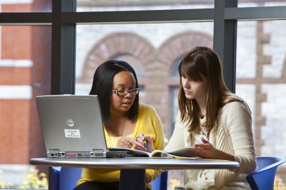 two female students studying together